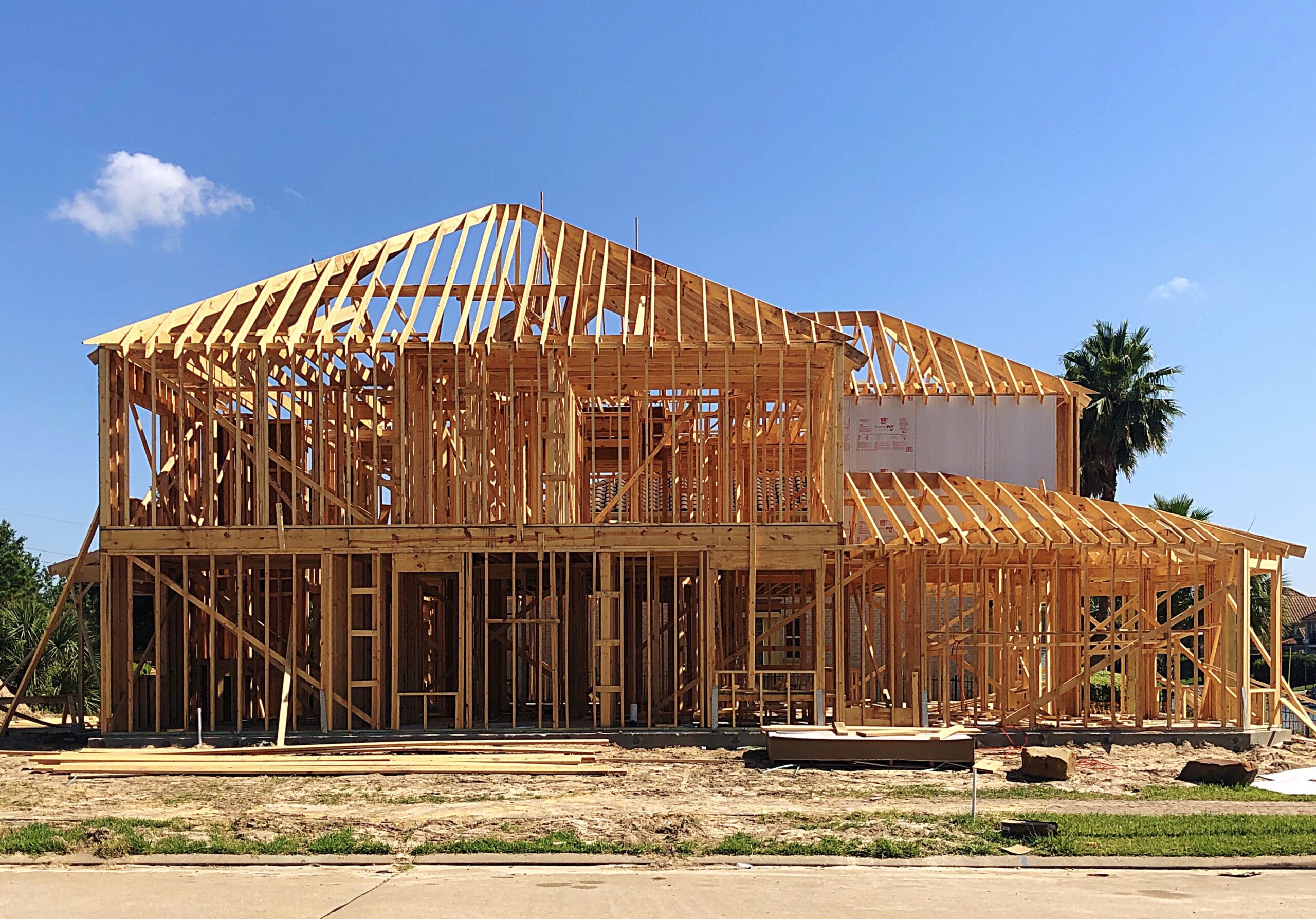 modern building construction with scaffolding under clear sky